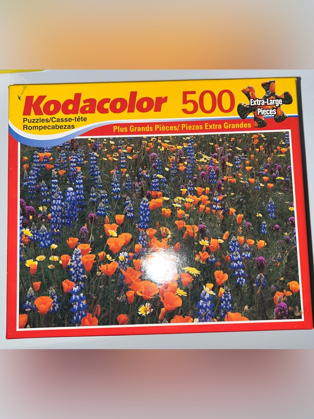 500-Piece Puzzle – Orange & Blue Wildflower Field